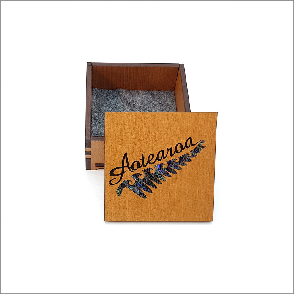 Small trinket box made of NZ Silver Beech with Rimu design and Paua inlay, perfect for storing keepsakes and jewelry.