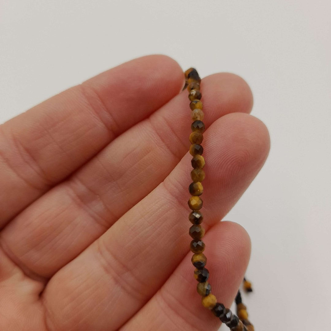 Set of 3 adjustable gemstone bracelets featuring star cut faceted tiger eye beads, promoting confidence and elegance.