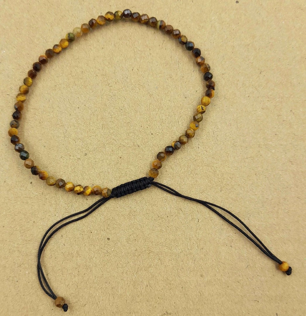 Set of 3 adjustable Star Cut Faceted Tiger Eye bracelets, featuring 3mm beads that promote confidence and courage.