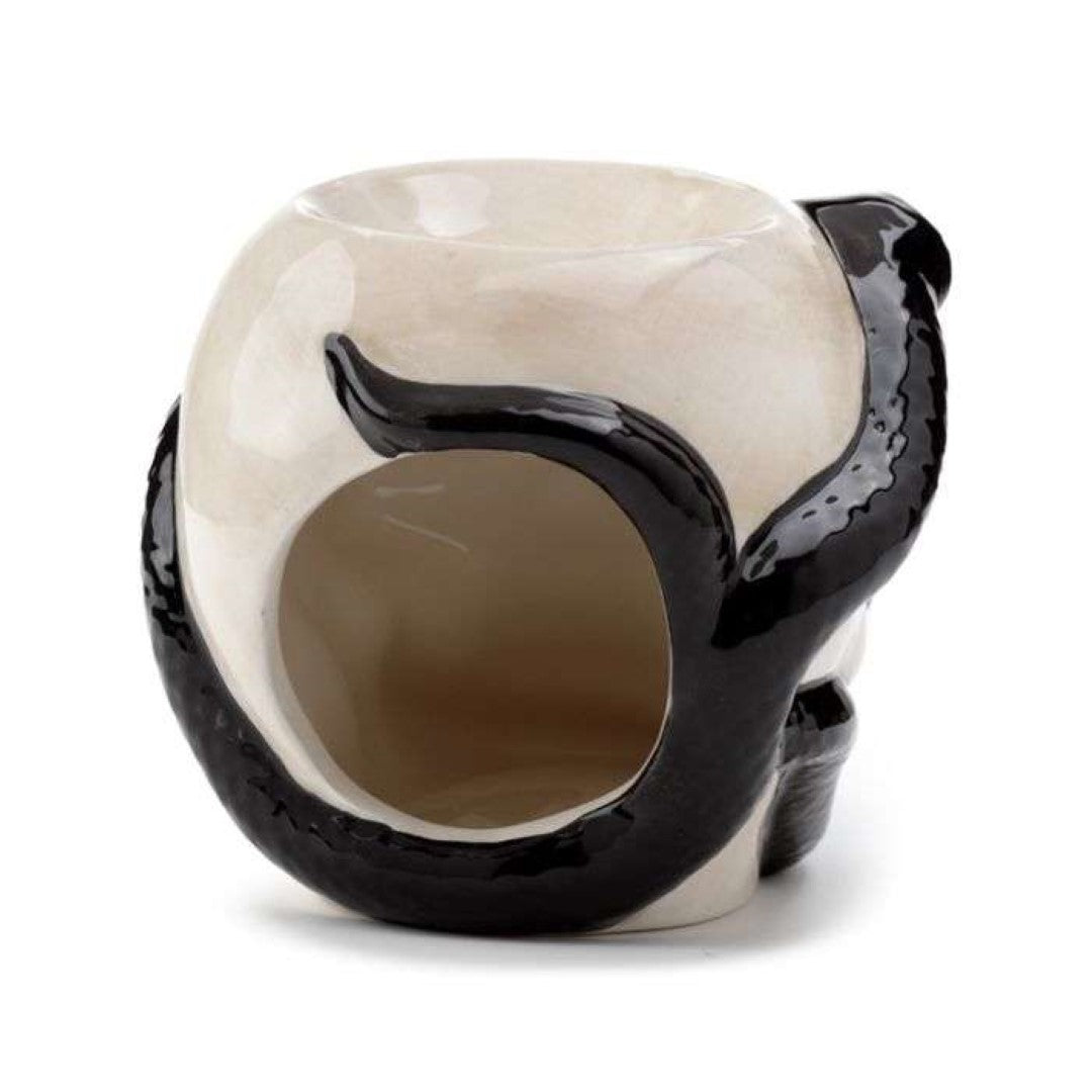 Ceramic oil burner shaped like a skull with a coiled snake, 13cm tall, perfect for gothic decor and aromatherapy.