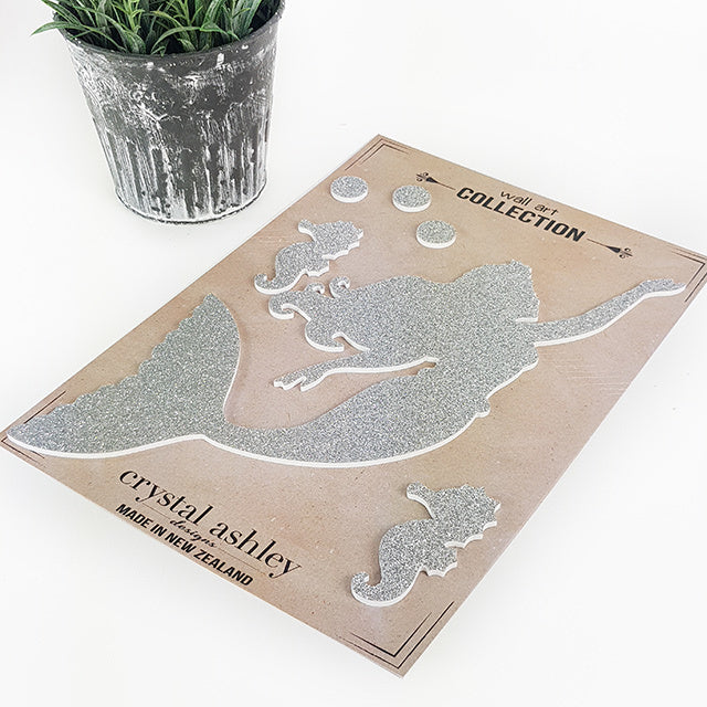 Whimsical glitter finish wall art featuring a mermaid and seahorse, perfect for kids' nursery decor.