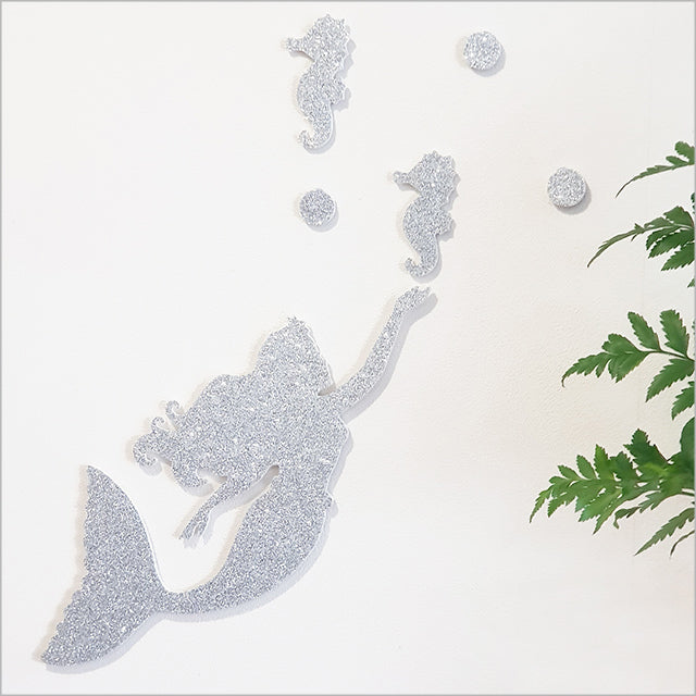 Whimsical mermaid and seahorse wall art set in glitter finish, perfect for children's nursery or bedroom decor.