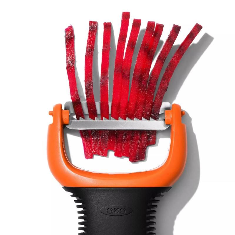 Three-piece OXO Good Grips peeler set featuring ergonomic handles and sharp stainless steel blades for effortless peeling.