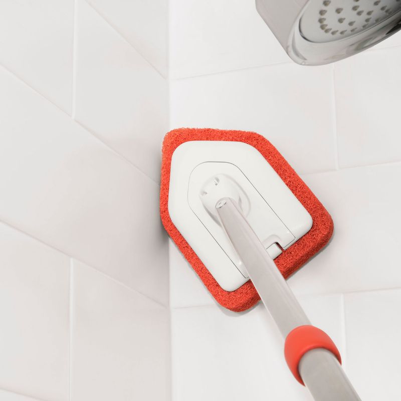 OXO Extendable Tub & Tile Scrubber with anti-microbial head, adjusts from 26" to 42" for effortless, deep cleaning.