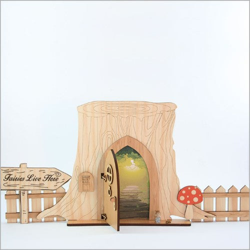 Enchanting fairy door kit featuring a tree trunk base, opening door, mailbox, fences, and fairy dust bottle for imaginative play.