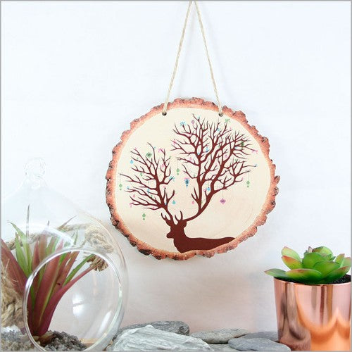 Wood slice wall art featuring a charming deer design, perfect for holiday decor in rustic or modern styles.