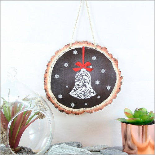 Intricate wooden wall art featuring filigree bell design, perfect for adding rustic charm to any living space.