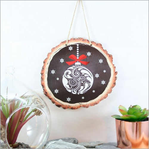 Intricate filigree design on wood slices, enhancing decor with rustic elegance, perfect for any living space.