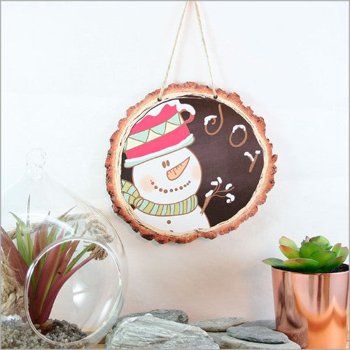 Charming wood slice wall art featuring a joyful snowman, perfect for festive winter decor and easy to hang.
