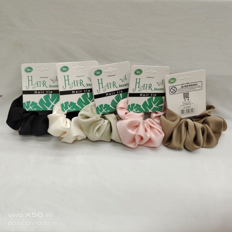 A set of 12 colorful, stretchy hair ties designed for all hair types, ensuring secure and stylish hairstyles without breakage.