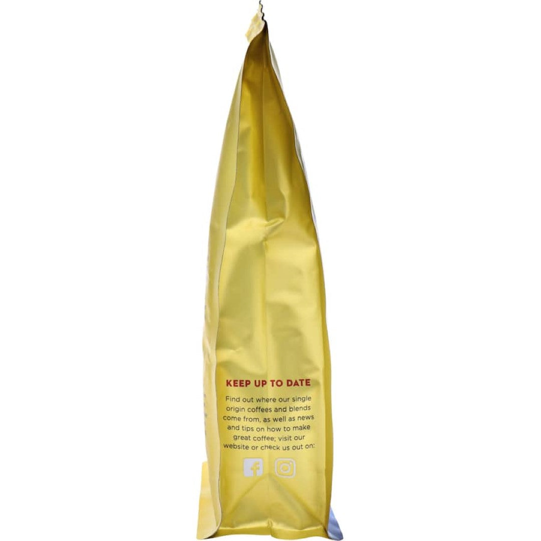 Caffe L'affare Fairtrade Organic coffee featuring rich plum, dark chocolate flavors, perfect for espresso or filter brewing.