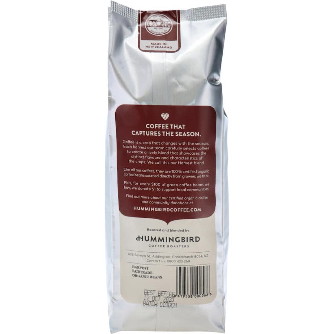 Hummingbird Fair Trade Organic Whole Beans Coffee from Colombia, featuring sweet peach and brown sugar notes in a 200g pack.