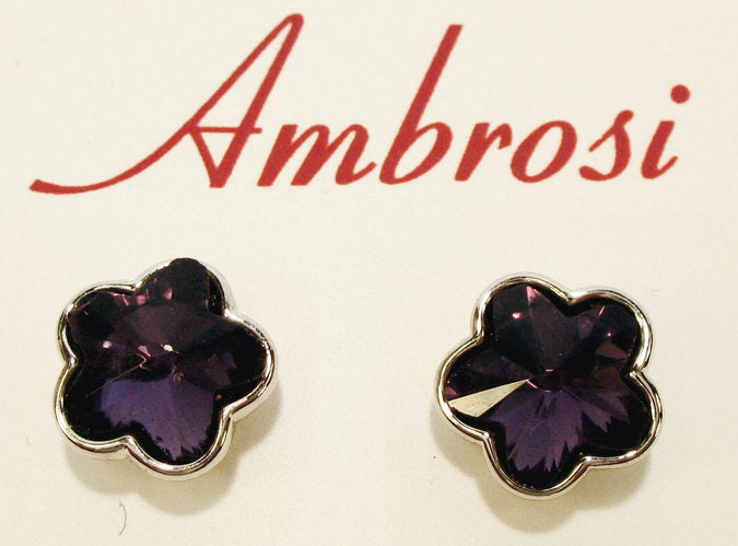 Elegant flower-shaped crystal stud earrings featuring tanzanite glass stones, crafted from hypoallergenic palladium.