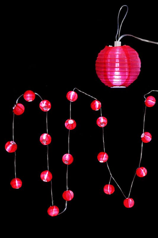 Elegant white sheer fabric LED lanterns, perfect for creating a warm ambiance at events or home decor.
