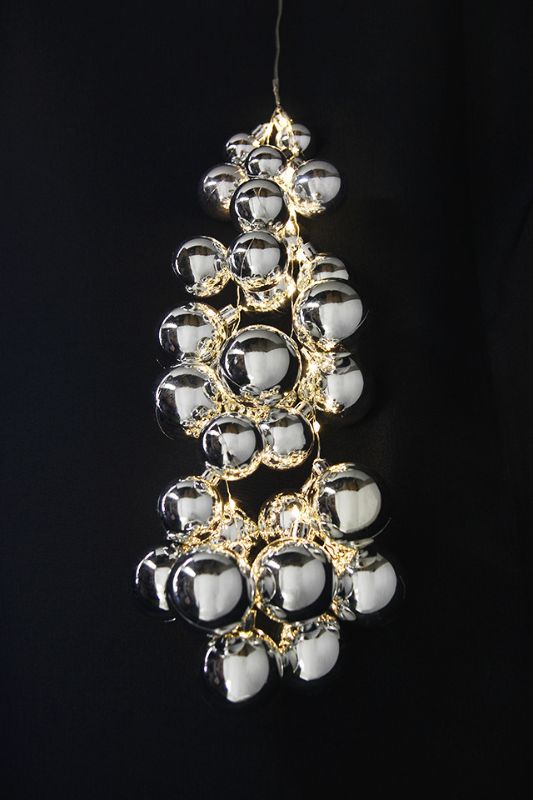 28 silver LED cascading baubles with warm white lights, ideal for festive tree or window displays, measuring 32 x 3/4/5cm.