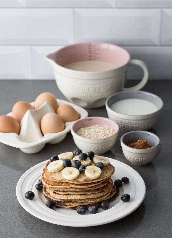 Mason Cash 3-piece measuring cup set in chip-resistant stoneware, featuring embossed measurements and space-saving design.