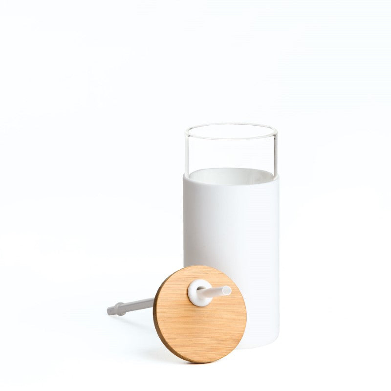 Elegant white Envy Glass Bottle with bamboo lid and silicone sleeve, perfect for stylish hydration on-the-go.