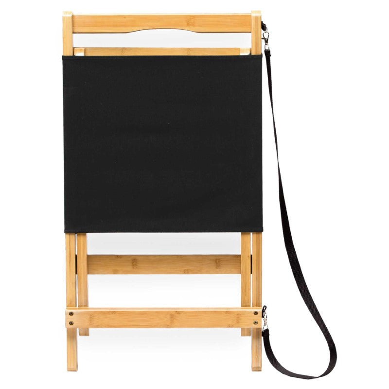Lightweight foldable Wave Beach Chair made of sustainable bamboo with a comfortable black canvas backrest, ideal for outdoor relaxation.