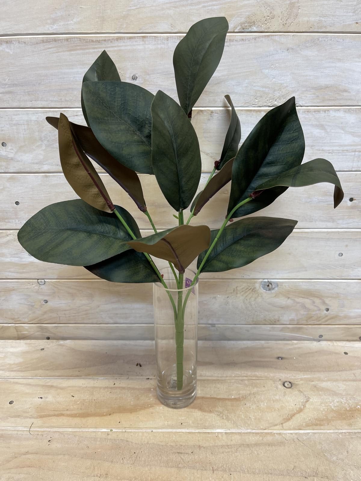 Lifelike magnolia leaf bush featuring Real Touch technology, perfect for elegant home decor and easy maintenance.