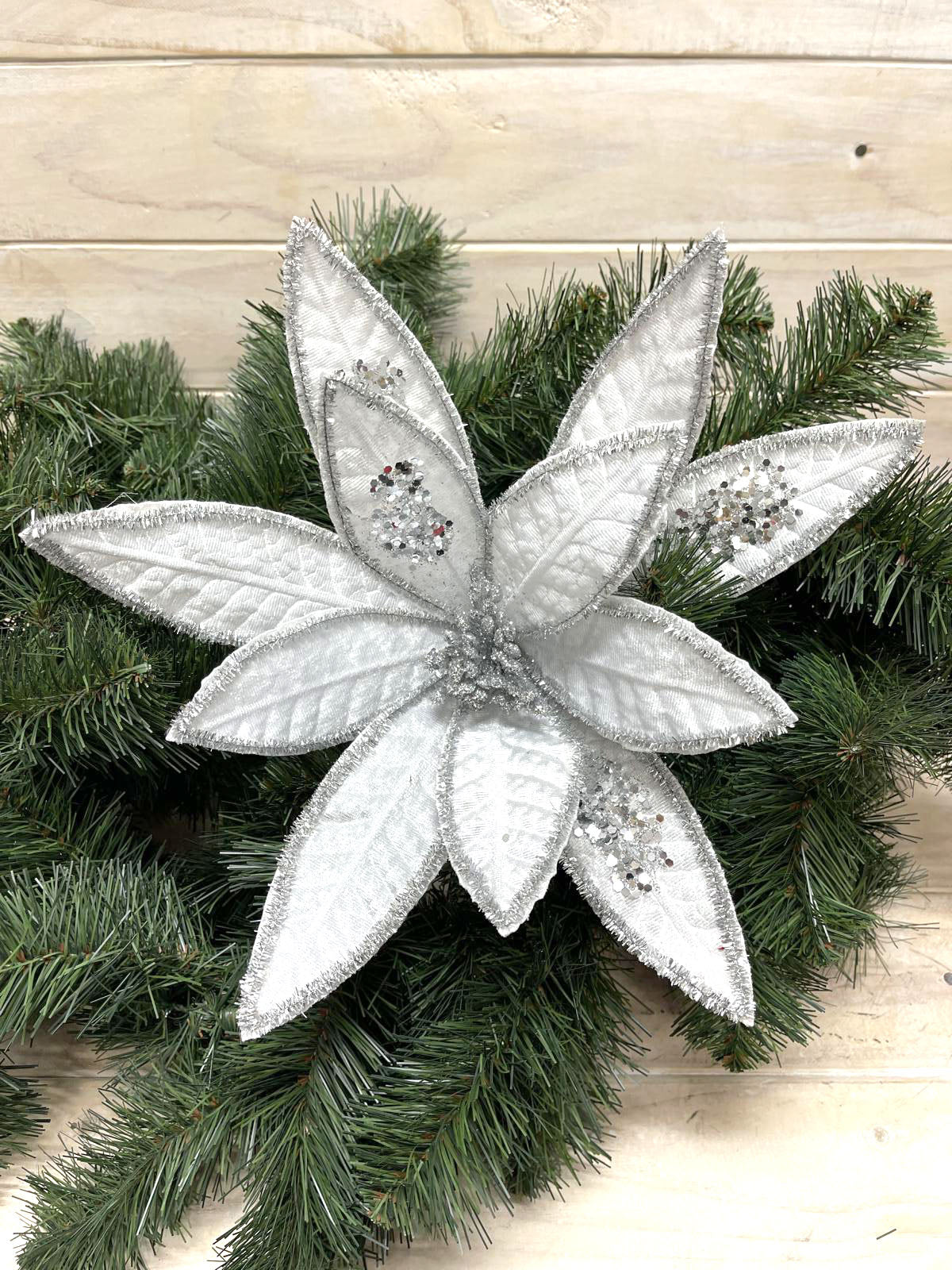 Lifelike long petal poinsettia stem in vibrant red, perfect for elegant home decor and seasonal displays.