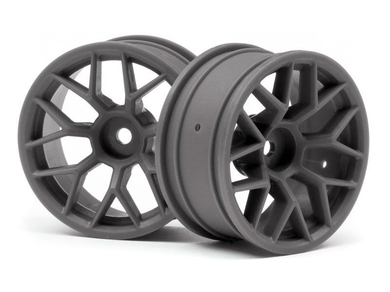 Sleek gunmetal 1/10 RC car with advanced tech, powerful motors, and durable chassis for high-speed outdoor and indoor racing.
