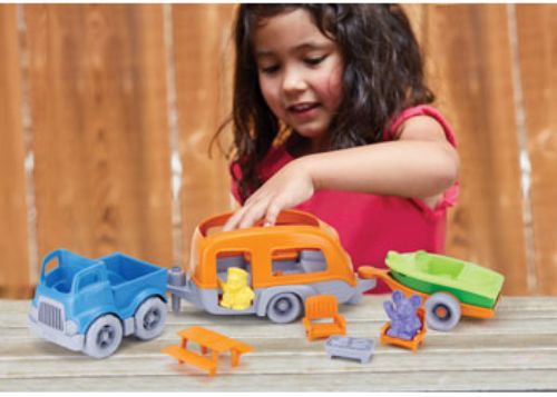 Green Toys RV Camper Set featuring a colorful camper van, two figures, and accessories for imaginative outdoor adventures.
