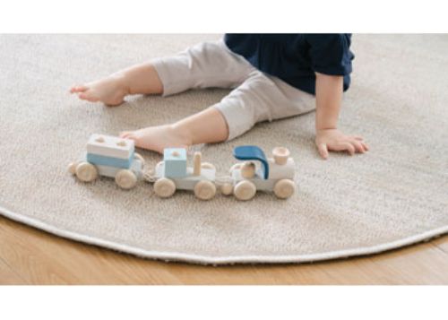Eco-friendly wooden stacking train set for toddlers, promoting creativity, coordination, and fine motor skills.