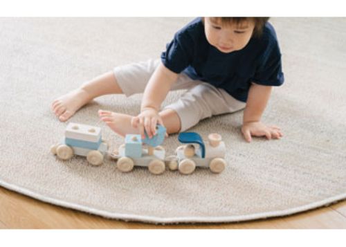 Colorful wooden stacking train set for toddlers, enhancing fine motor skills and imaginative play. Eco-friendly and safe.