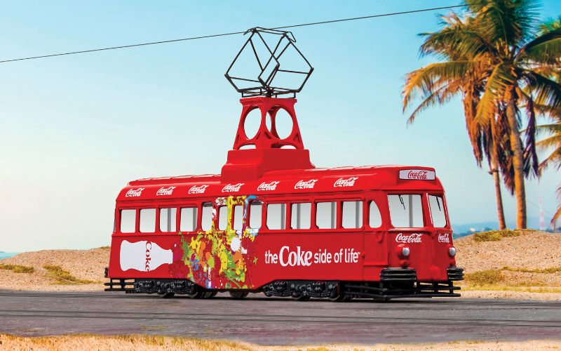 Corgi 1/76 diecast Coca-Cola tram model showcasing 'Coke Side of Life' branding, perfect for collectors and nostalgic displays.
