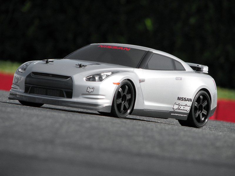 Alt text: "Nissan GT-R R35 RC car body, 200mm, featuring durable design, realistic decals, and street wing for precision racing."