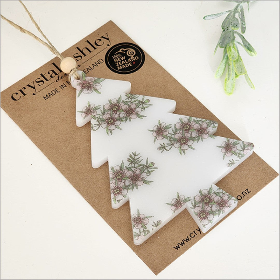 Satin acrylic hanging ornament in the shape of a Manuka tree, intricately laser-cut, ideal for festive decor or gifting.