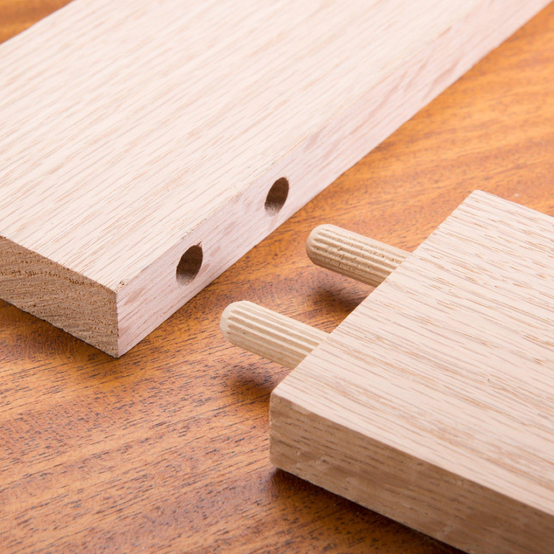 60-pack of 6mm fluted wooden dowels made of durable beech wood, ideal for strong and precise woodworking joints.