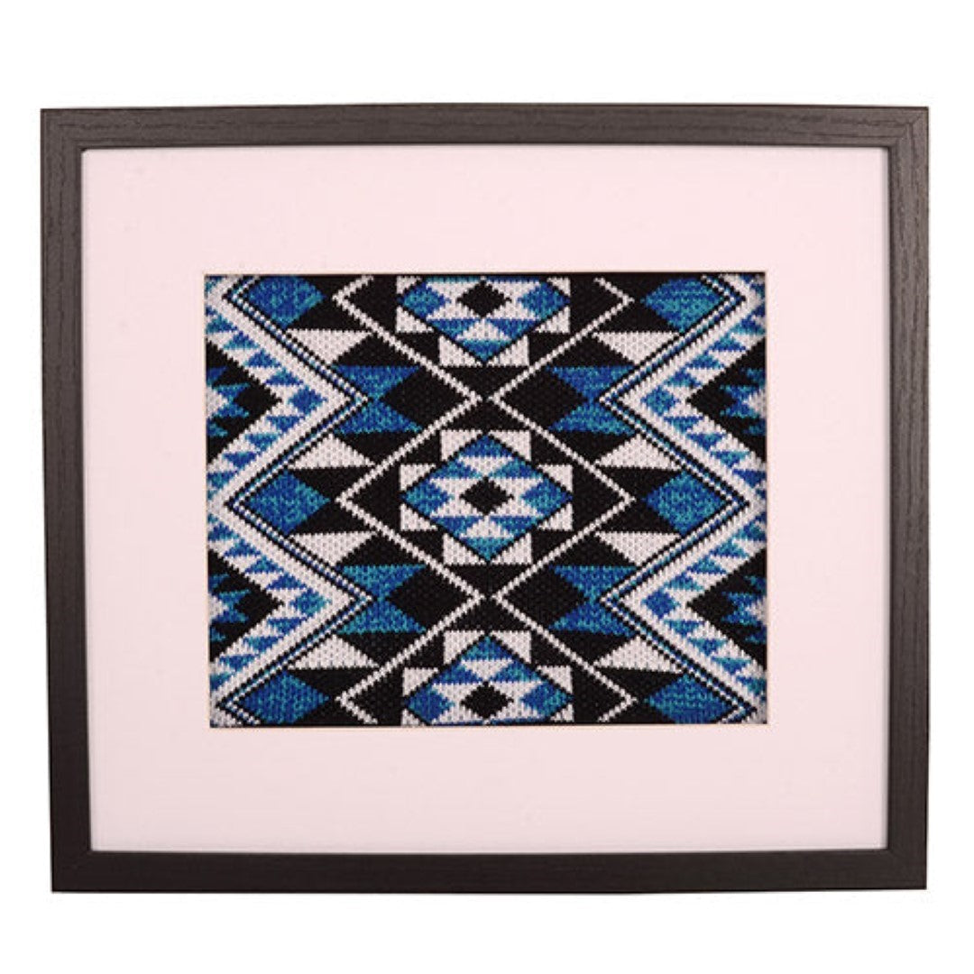 Framed art showcasing the Taniko Band Blue, a handcrafted tribute to Maori culture with symbolic patterns and modern appeal.