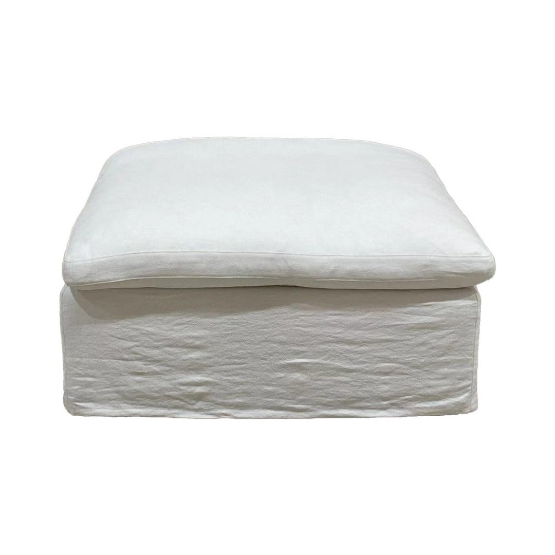 Plush cloud-colored Carlton Ottoman, perfect for seating or a footrest, enhancing any living space with style and comfort.