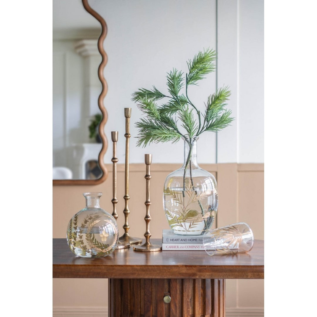 Elegant gold aluminum taper candle holder, 11.4 x 11.4 x 39.4 cm, perfect for adding sophistication to any decor.