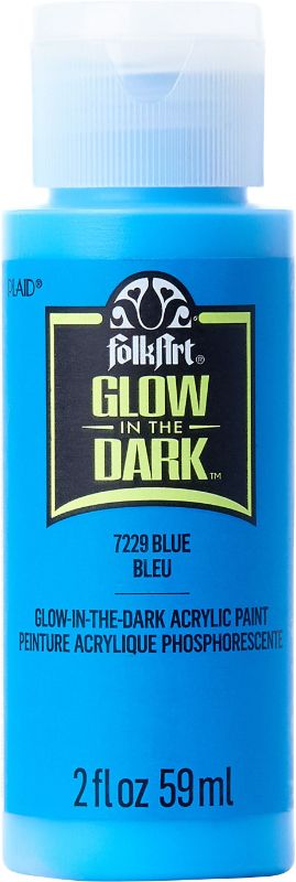 Bright blue Folk Art acrylic glow-in-the-dark paint in a 2oz bottle, ideal for creative DIY projects and art enhancements.