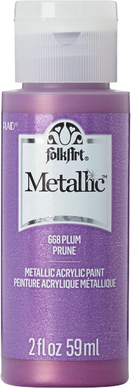 Folk Art Metallic Paint in PLUM JA668, 2oz, offers a rich shimmering finish for various craft projects.