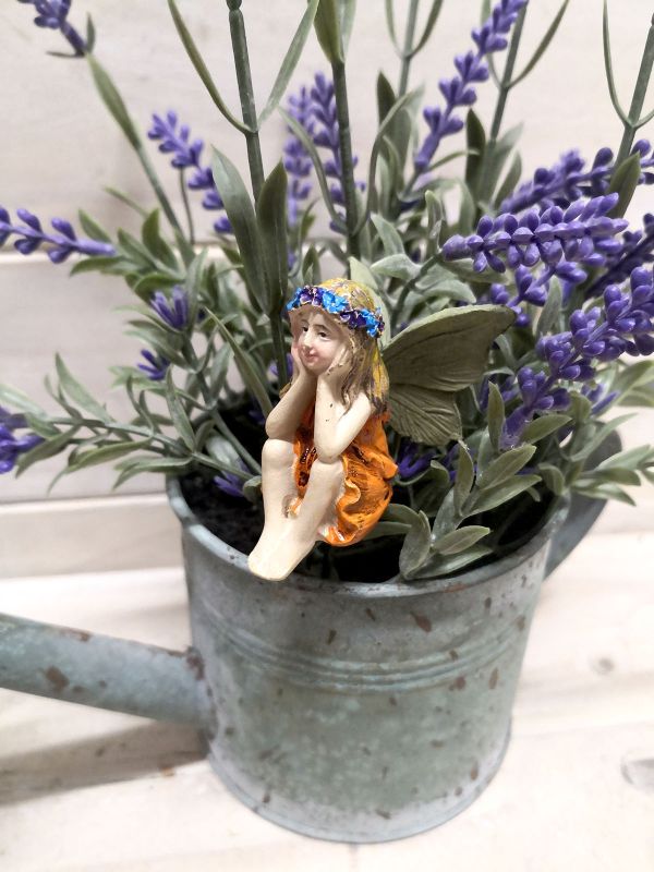 Set of 6 whimsical fairy picks with intricate designs for garden decor, flower beds, or party decorations.