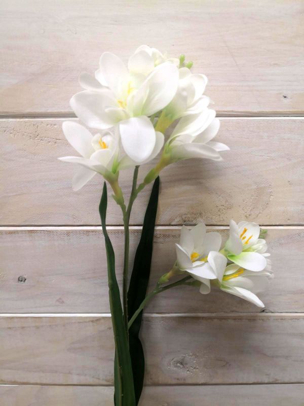 Lifelike Real Touch Freesia blooms in a vase, brightening up any space with vibrant color and requiring no maintenance.