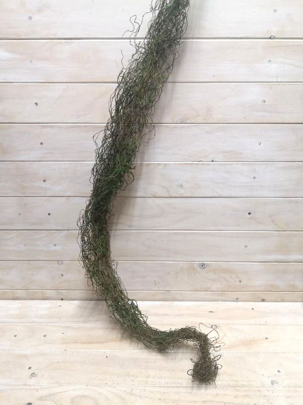 Lifelike 125cm brown twig bundle with soft moss accents, perfect for enhancing home decor in any light.