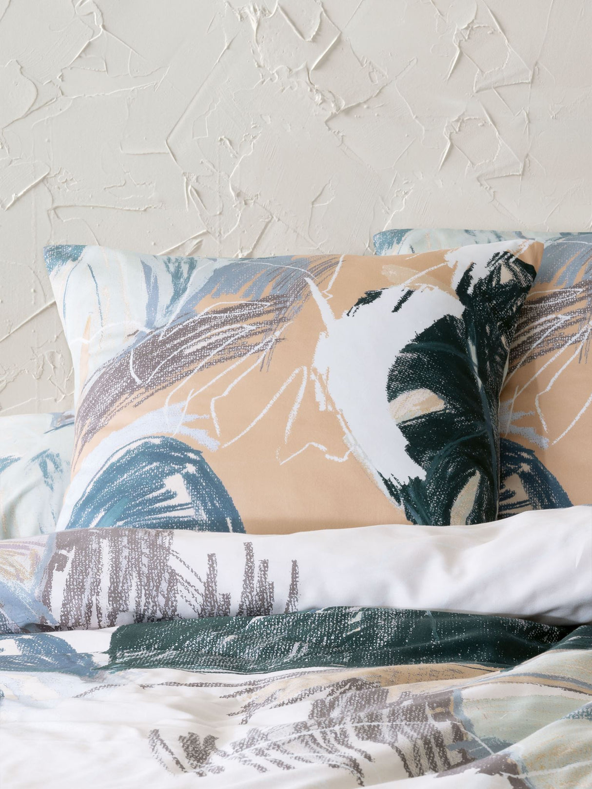 King Duvet Cover Set by Savona with tropical greenery design on luxe cotton sateen, includes duvet cover and pillowcases.