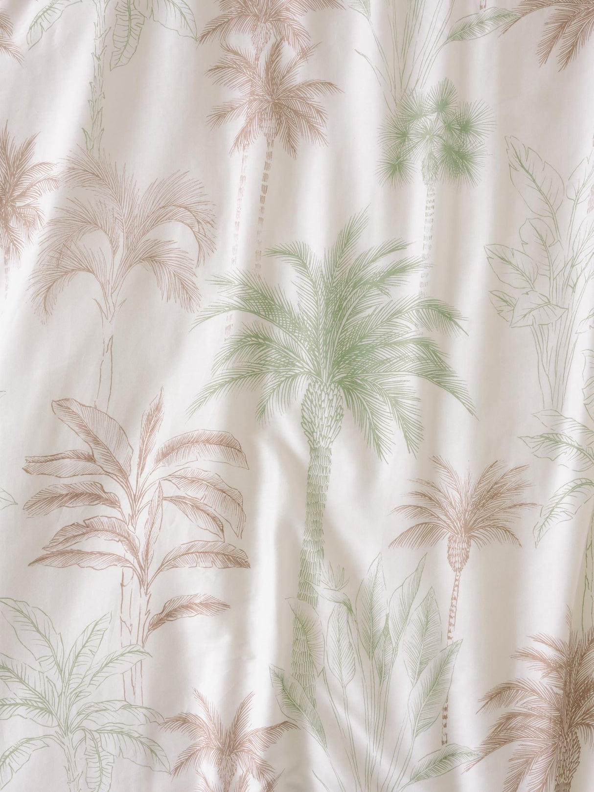 Lombok Duvet Cover Set in tropical palm design, featuring smooth 100% cotton, ideal for King beds, includes matching pillowcases.