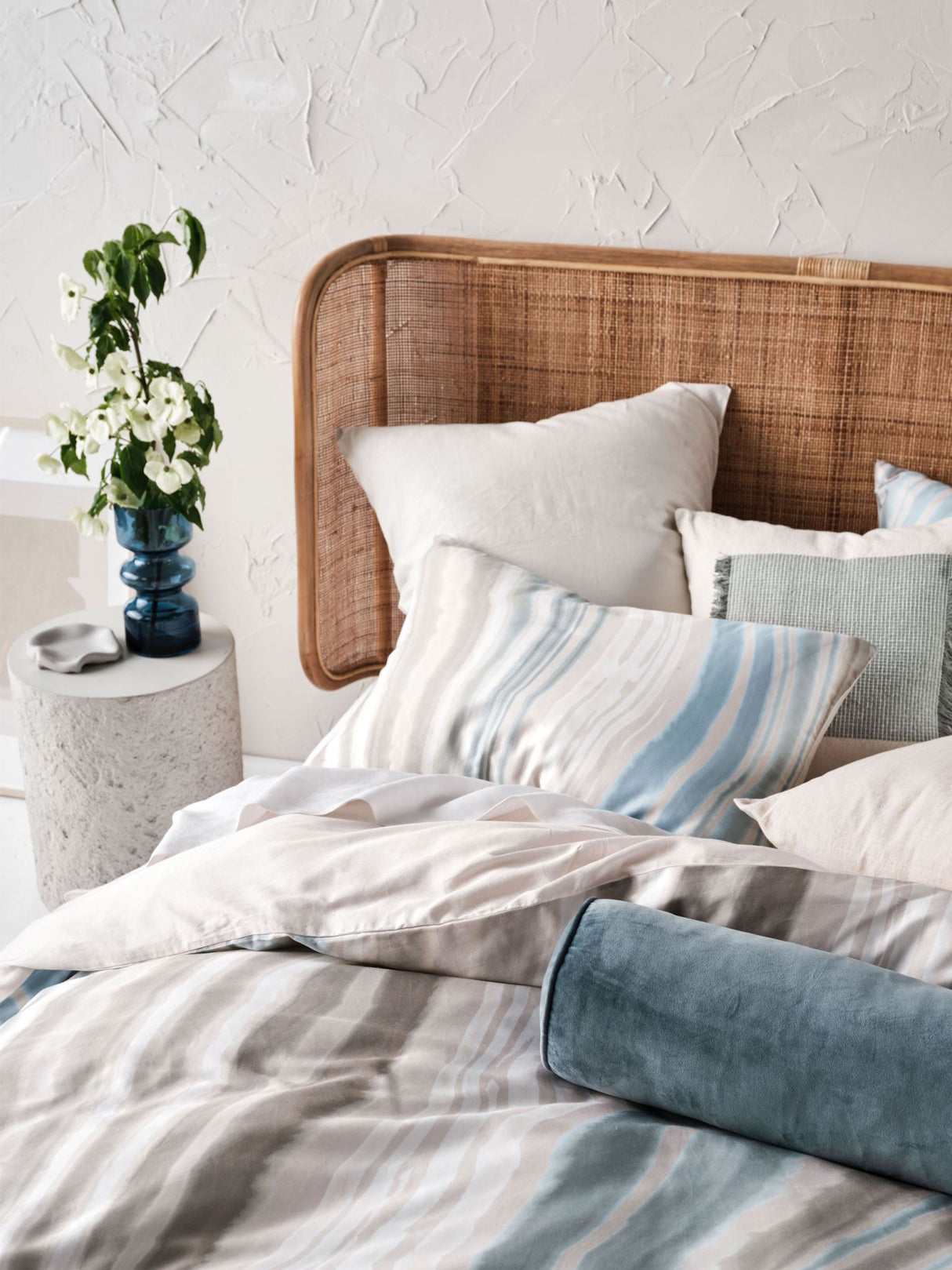 Super King duvet cover set featuring a marble design in blues and earth tones, crafted from soft 100% cotton sateen.