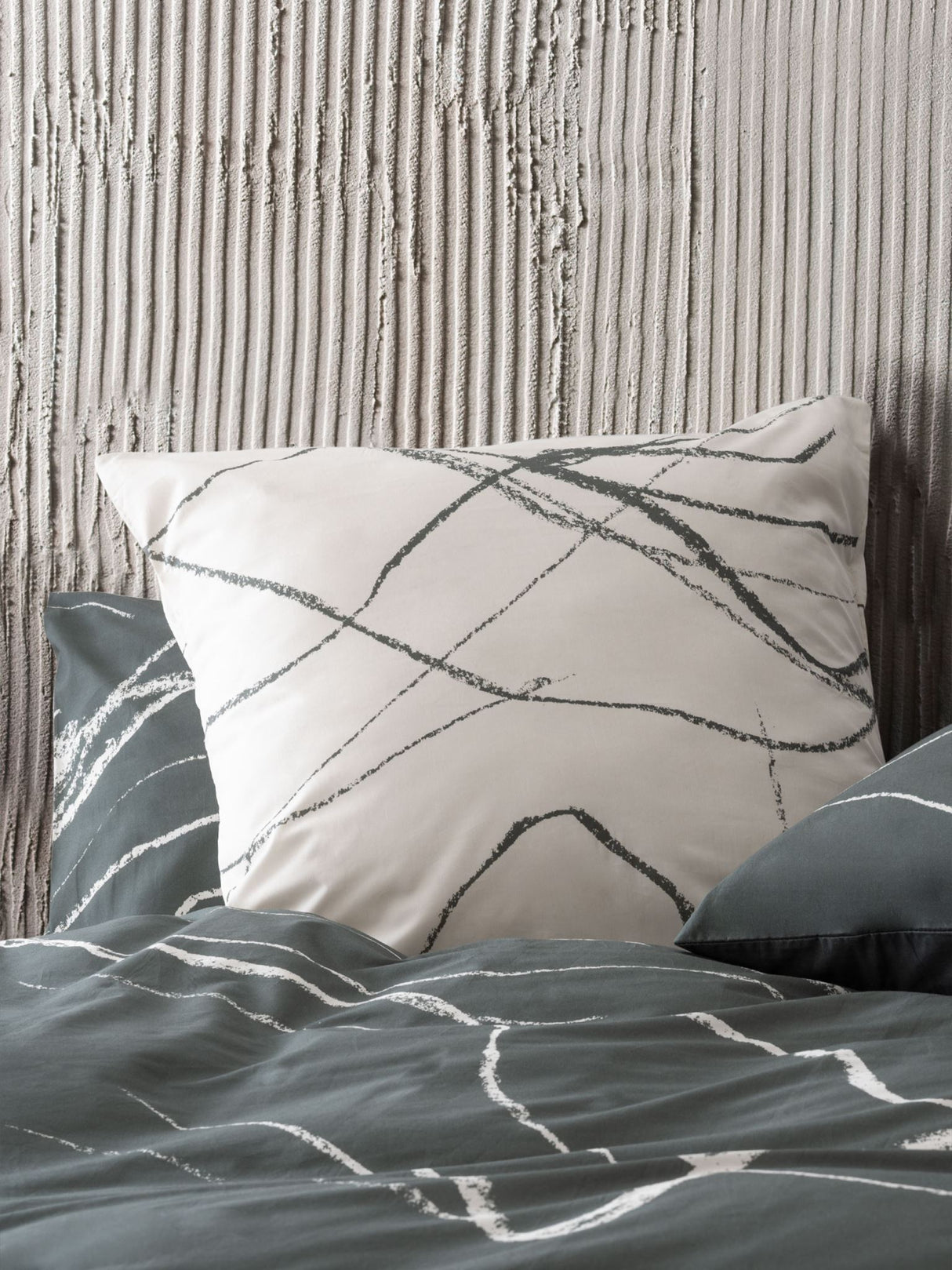 King duvet cover set featuring hand-drawn charcoal design inspired by nature, made from 100% cotton sateen.