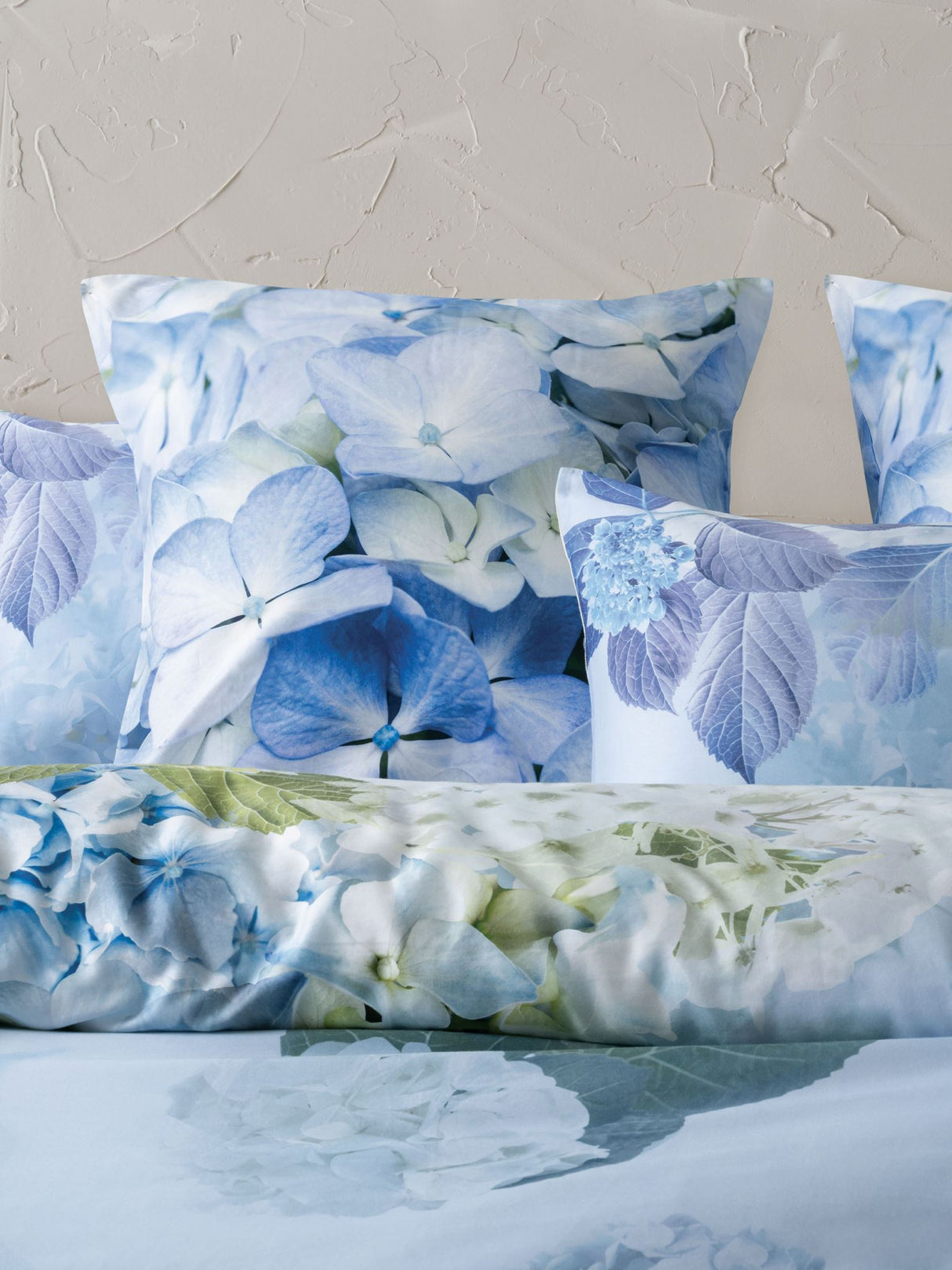 Floral Thea Duvet Cover Set in sage with hydrangeas, crafted from soft cotton sateen for Queen beds, includes matching pillowcases.
