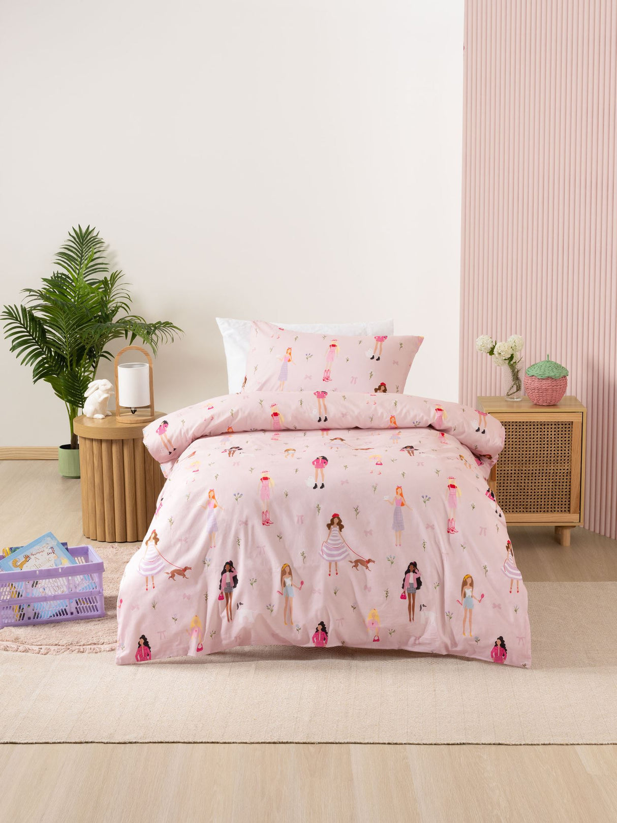 Single duvet cover set featuring chic characters on a pink backdrop, 100% cotton, reversible to vibrant candy pink.
