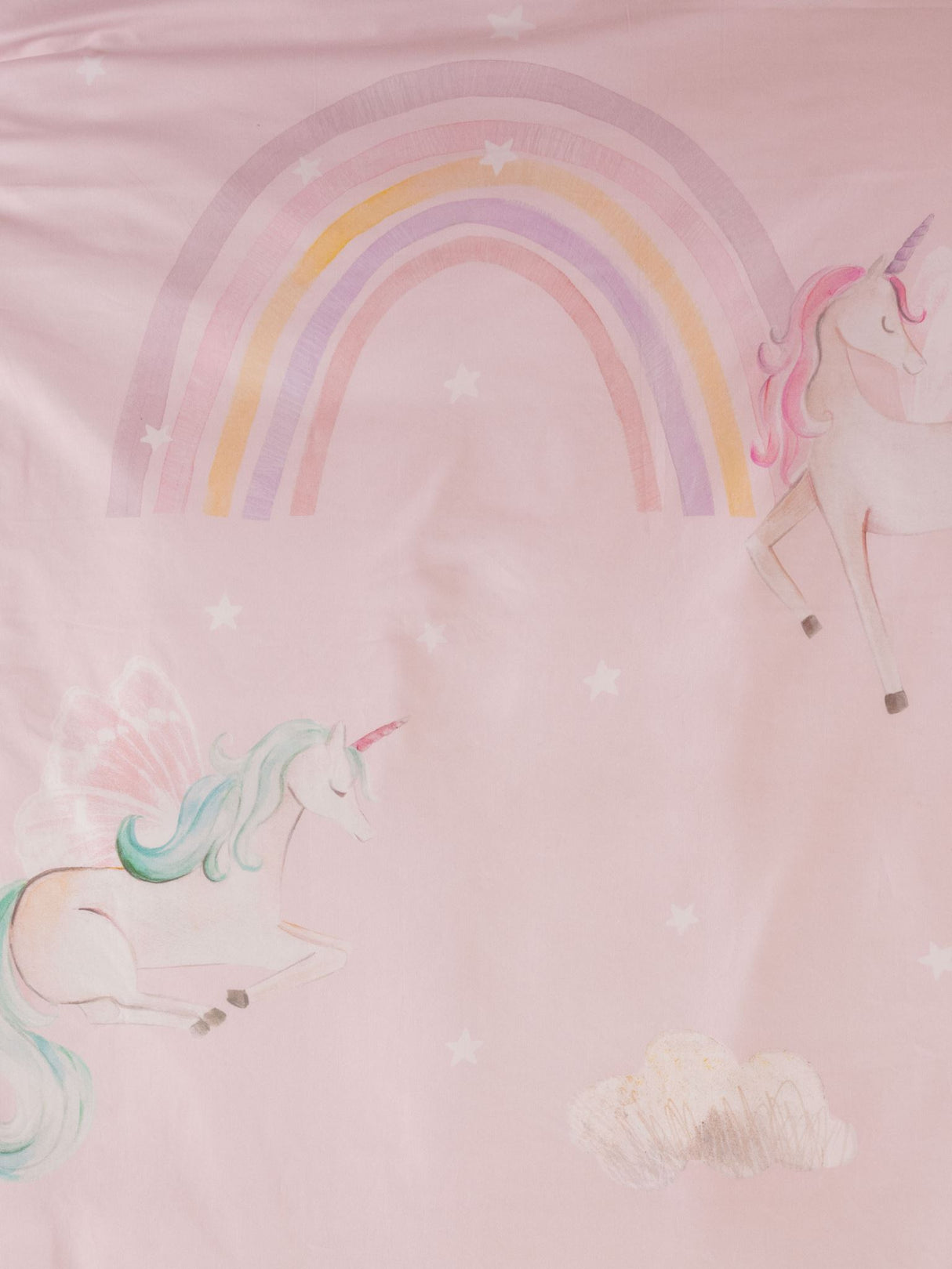 Single duvet cover set featuring whimsical unicorns, rainbows, and clouds on a pink background for a magical bedroom.