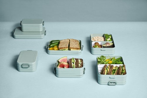 Vibrant mauve bento box with two compartments, extra box, fork, and microwave-safe tray for convenient, healthy lunches.
