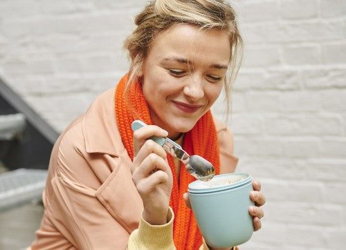 Vivid blue lunch pot with two compartments for separate storage of meals, microwave and dishwasher safe, BPA-free design.
