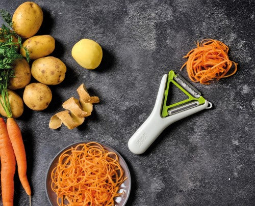 Switch 2in1 Peeler by Joseph Joseph features ergonomic Y-shape, stainless-steel blades, and a potato-eye remover for efficient peeling.